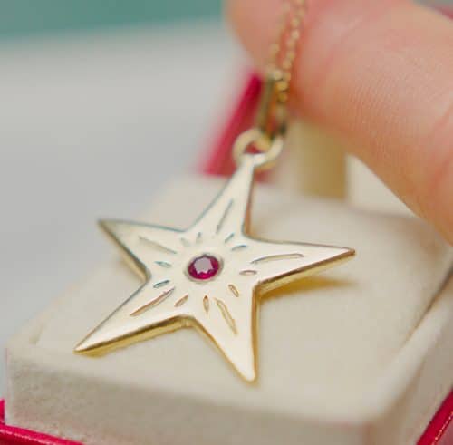 gold and ruby star pendant